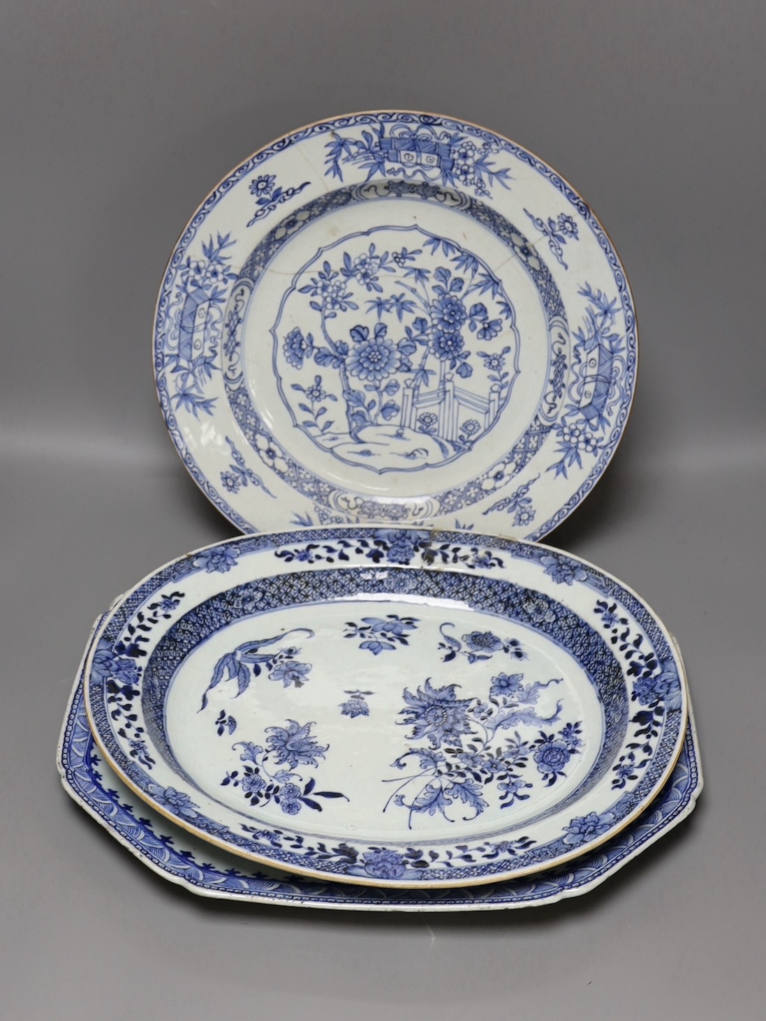 Three Chinese export blue and white dishes, 18th/19th century, largest 42 cms wide